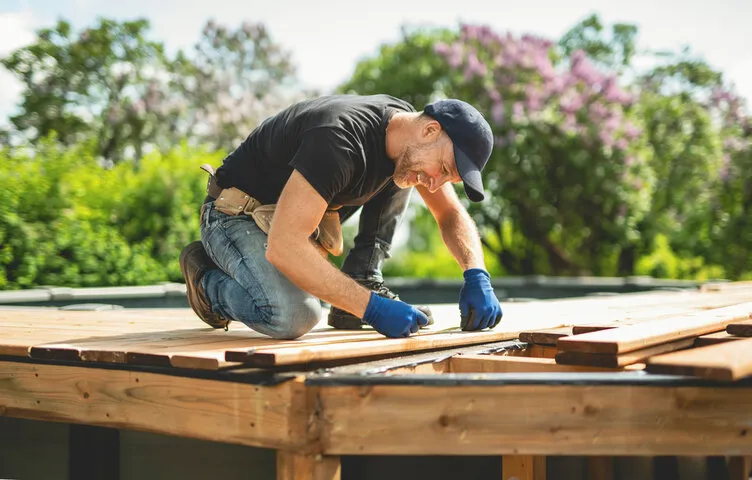 Experienced TUFF Deck Builders team using precision tools to construct a structurally sound floating deck in Toledo.