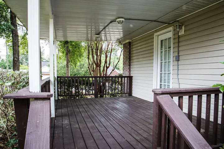 Welcoming custom front porch designed to significantly enhance a home's curb appeal while perfectly complementing its architectural style.