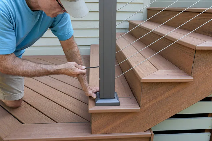 Highly skilled professional porch installers in Toledo completing the precise and flawless installation of a new residential porch structure.